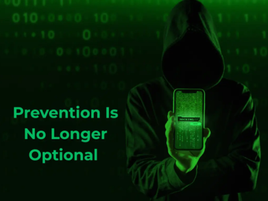 Cybersecurity alert: smartphone screen showing “Prevention Is No Longer Optional” held by person in hoodie.